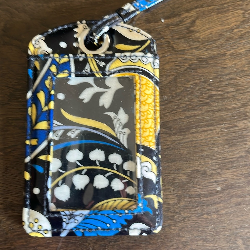 Vera Bradley luggage tag. Whimsical blue yellow and white. 4” long.